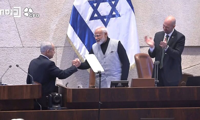 Indian Prime Minister Narendra Modi and Israeli officials shake hands during a formal event.