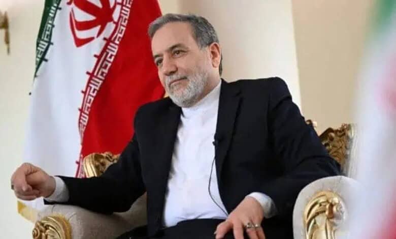 Iranian Foreign Minister during nuclear talks with US, seated in a formal setting.