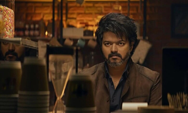 Vijay, the famous Tamil actor, appears in a dramatic scene, reflecting his intense expression and stylish.