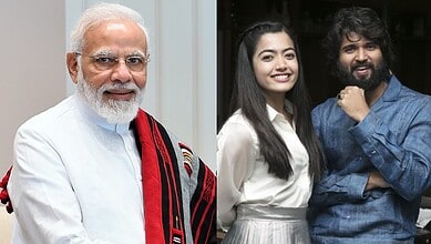 Narendra Modi with two young professionals smiling at an event, promoting innovation and leadership.
