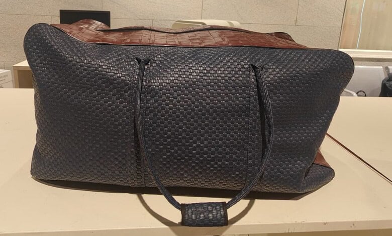 Black duffel bag suspected to contain illegal items seized at Bengaluru Airport.