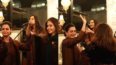Women dancing to 'Mast Kalandar' at Siasat Daily gathering.