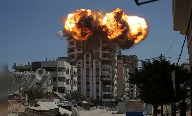 Explosion in Gaza building during conflict, highlighting the devastation faced by civilians.