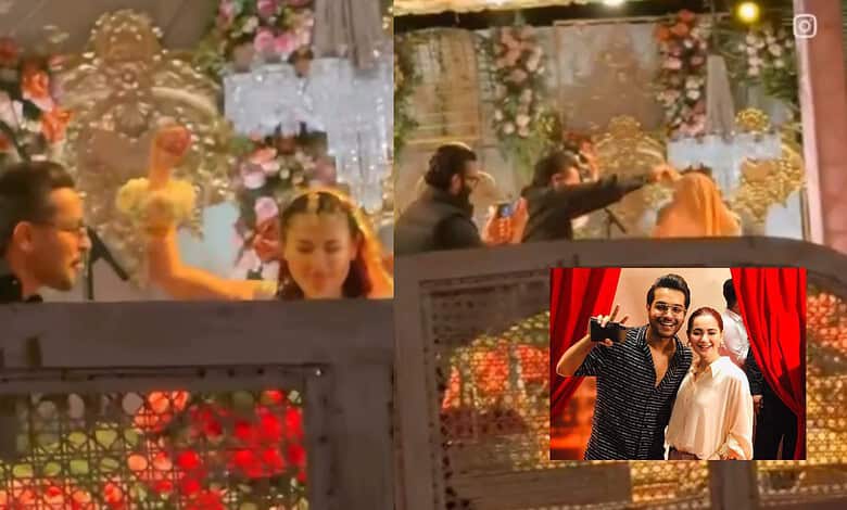 Hania Aamir and Asim Azhar dancing together at a wedding celebration.