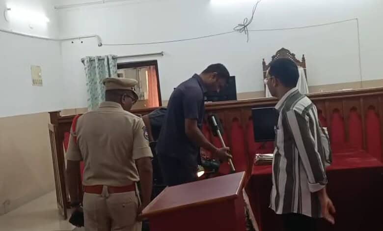 The image shows the bomb squad searching for explosive material inside the Warangal District Court after the court authorities received a bomb threat on Thursday, February 26, 2026.