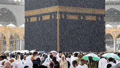 Worshippers pray for rain at the Kaaba during heavy rain in Mecca.