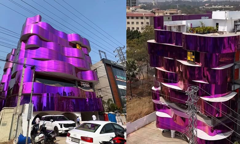 Colourful purple building with unique curved design in Hyderabad.