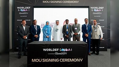 Group photo of officials at the AI centre signing ceremony in Dubai.