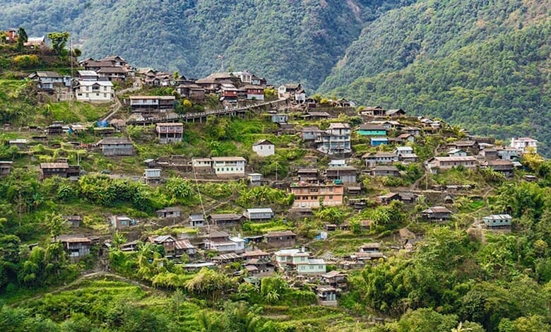 Village community with hillside houses in India, showcasing honesty and simplicity in a secure environmen.