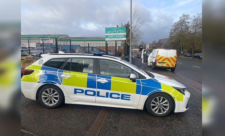 Police car and forensics van outside Oldbury Jamia Masjid in Smethwick, England, where an 18-year-old died after a stabbing.