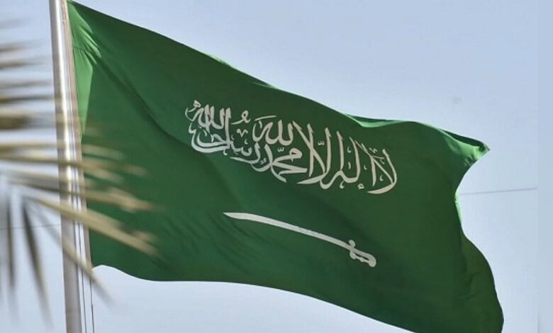 Saudi Arabian national flag waving against the sky