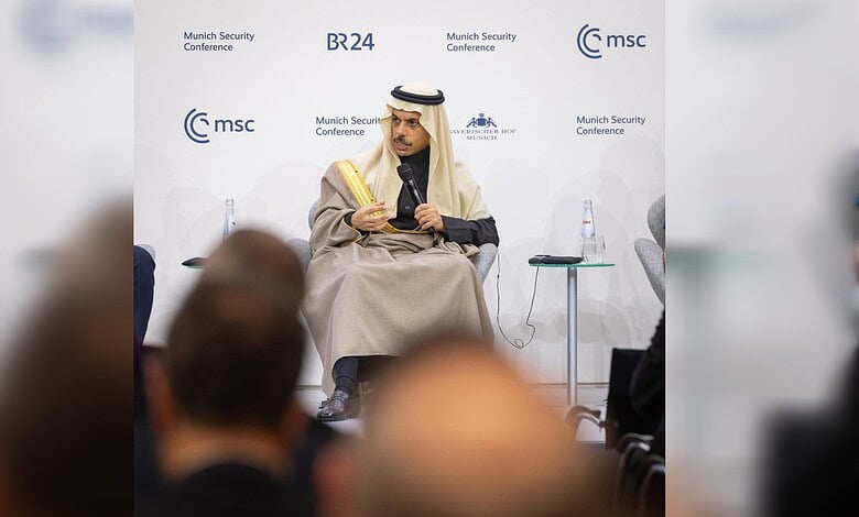 Security conference speaker in traditional Middle Eastern attire speaking at Munich Security Confere.