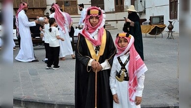 Saudi children in traditional dress celebrate Founding Day in Diriyah.