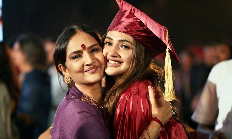 Sreeleela in graduation gown with her mother at her graduation ceremony.