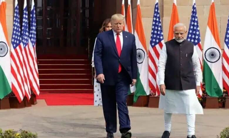 Leaders of India and the US walking past flags during diplomatic discussions.