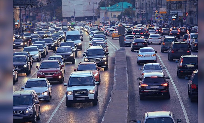 Traffic jam in Telangana with vehicles on the road, related to vehicle registration and road safety.