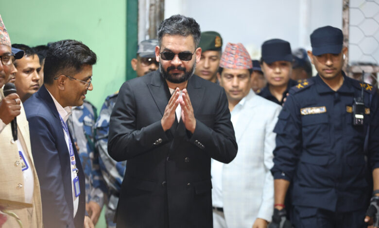 Balendra Shah, foreground, former mayor of Kathmandu Metropolitan City and prime ministerial candidate of the Rastriya Swatantra Party, arrives to receive his victory certificate