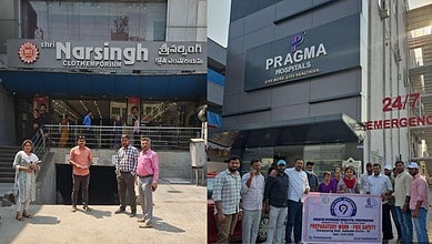 Group of people standing outside Shri Narsingh Cloth Emporium and Pragma Hospitals in Hyderabad.