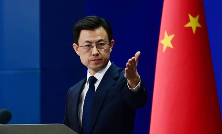 Chinese official announces USD 200K aid for victims of Iranian school bombing at press conference.