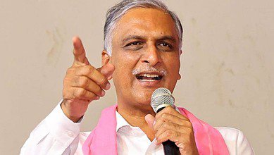 Telangana Chief Minister addressing officers, raising his finger during a political rally.