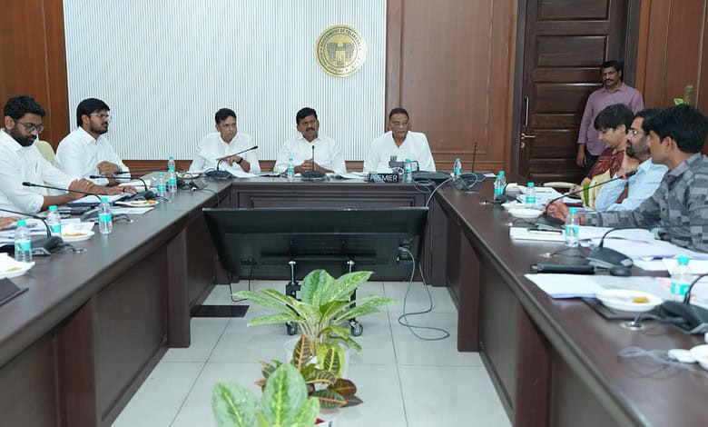 Telangana officials discuss housing policy in a formal meeting.