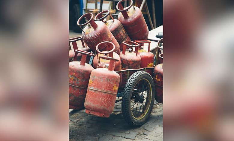 Collection of LPG cylinders on a cart, ready for distribution or storage.