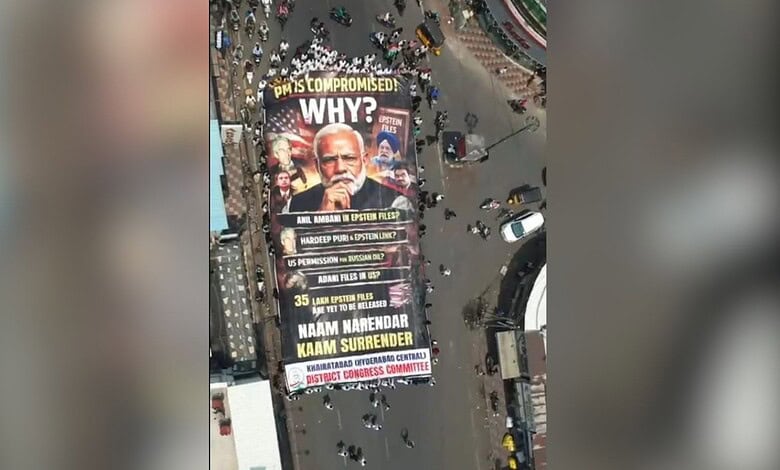 Large protest banner in Hyderabad criticising Narendra Modi, highlighting political issues and demanding accountability during a Congress protest.