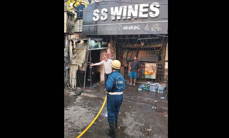A fireman at work at SS Wines, Somajiguda