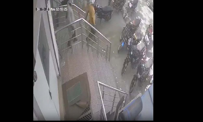 Security personnel and bystanders outside a building after a fatal incident involving a bank manager and.