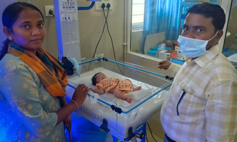 The image shows the officials, and the rescued newborn baby getting treated at the SNCU of Asifabad Government Hospital on Saturday, March 21, 2026.