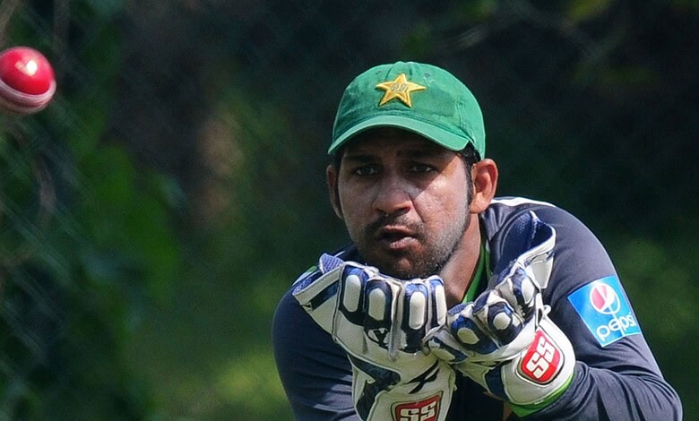 Pakistan's young cricket coach practicing fielding drills during training.