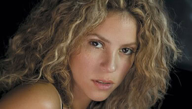 Shakira performing at her record-breaking concert in Mexico City, captivating thousands of fans with her.
