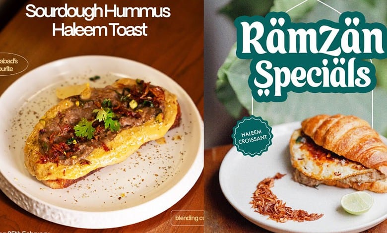 Sourdough hummus haleem toast garnished with herbs on a white plate.