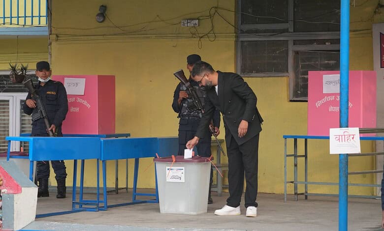 A man votes in Nepal's elections