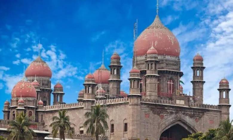 Historic Kaleshwaram palace with domes and minarets under a blue sky, surrounded by palm trees.