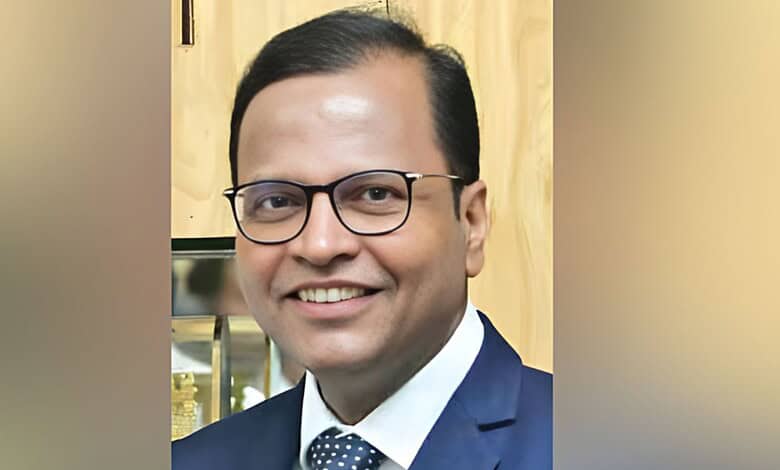 Portrait of Telangana Chief Secretary Ramakrishna Rao smiling in formal attire.