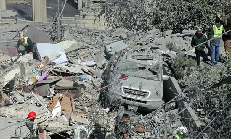 An image showing the aftermath of a military attack with damaged vehicles, rescue workers, and debris, hi.