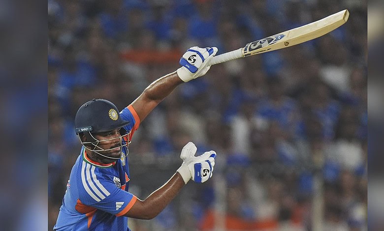 India cricket player hitting a six with a bat during the T20 World Cup final.