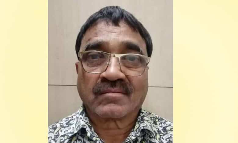 Man with glasses and patterned shirt, close-up portrait for The Siasat Daily.