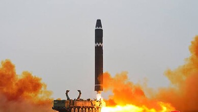 North Korean missile being launched into the sea amid rising tensions.
