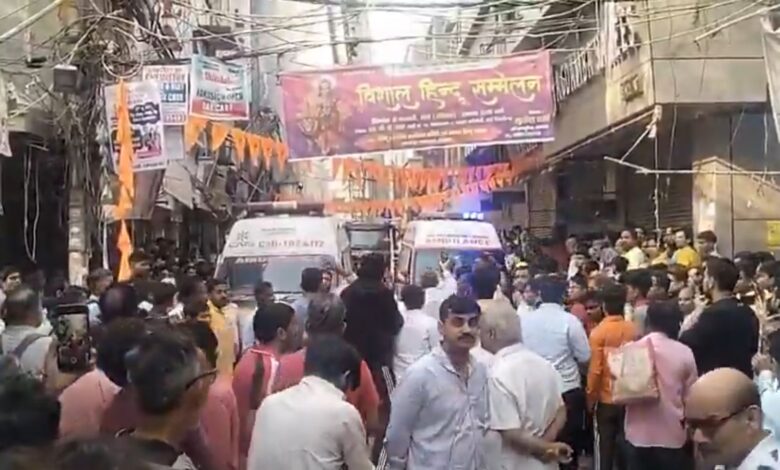People gather outside building in Delhi
