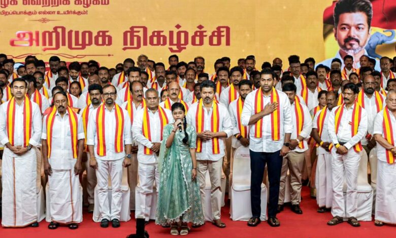 TVK President Vijay poses with his candidates for the Tamil Nadu elections