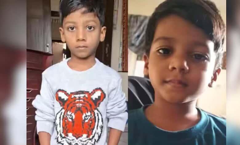 Young boy with serious expression, wearing a blue shirt, after battling a dog bite for 15 months.