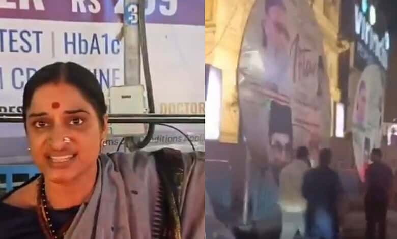 Madhavi Latha tears down AIMIM iftar posters in front of Virinchi Hospital during a political demonstrati.
