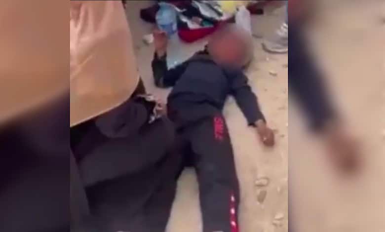 Deported Jewish-American man lying on the ground after witnessing a Palestinian child hit by a car in Wes.