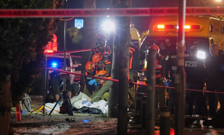 Israeli first responders remove the body of a person killed in an Iranian missile strike in Tel Aviv, Israel, early Saturday, March 28, 2026. AP/PTI