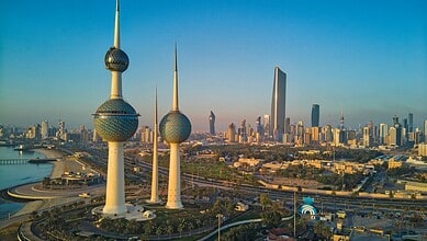Kuwait Towers and Kuwait City skyline overlooking the Arabian Gulf.
