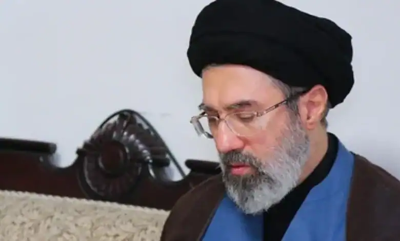Mojtaba Khamenei wearing black turban and glasses.