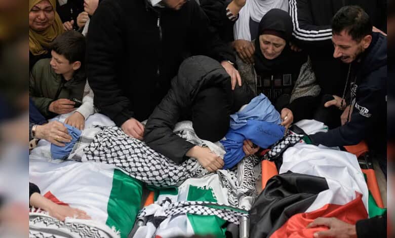 People assisting a person in distress at a crowded event, showing compassion and urgency.