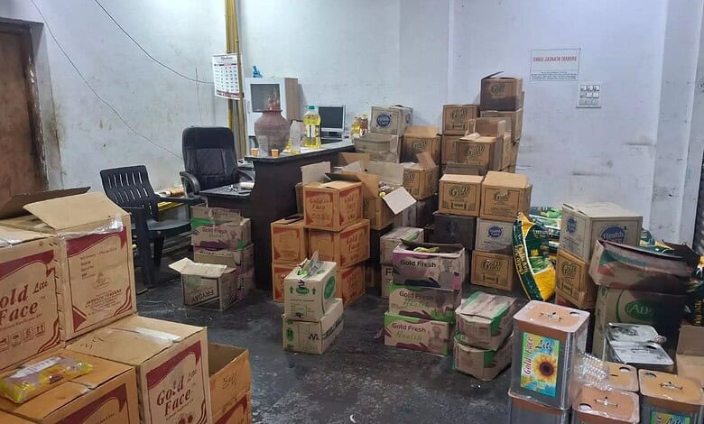 Seized adulterated cooking oil and wheat flour worth Rs 21 lakh in Hyderabad, displayed in a storage room.